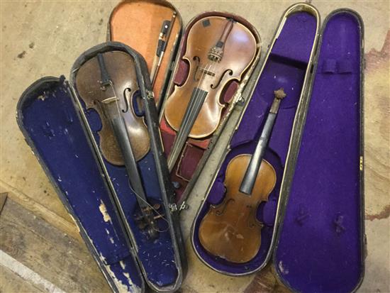 2 violins in cases & 1 half size violin